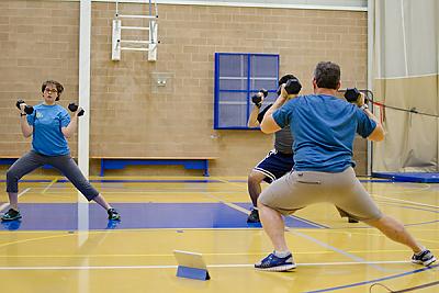 Landmark College students lifting weights in fitness class